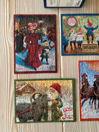 4 x Juleminipuslespil med 99 brikker fra Penny Puzzle
