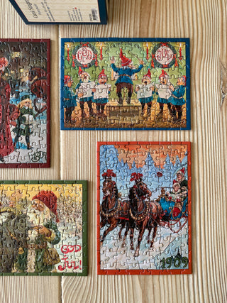 4 x Juleminipuslespil med 99 brikker fra Penny Puzzle
