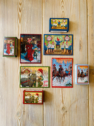 4 x Juleminipuslespil med 99 brikker fra Penny Puzzle
