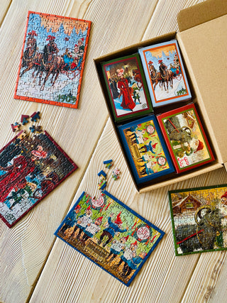 4 x Juleminipuslespil med 99 brikker fra Penny Puzzle