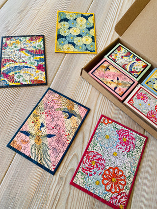 4 x Japansk minipuslespil med 99 brikker fra Penny Puzzle.