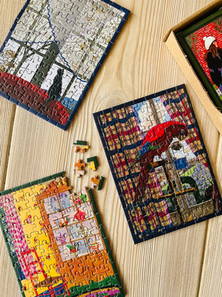 4 x Vintage Homes minipuslespil med 99 brikker fra Penny Puzzle.